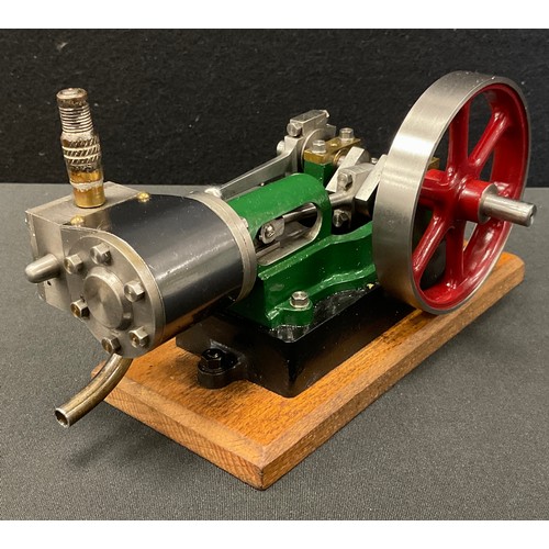 256 - A Stuart single cylinder stationary live steam engine. Horizontal engine with 130mm flywheel. Mounte... 