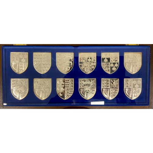 257 - The Royal Arms, In celebration of Queen Elizabeth II's Silver Jubilee 1977, a set of twelve silver p... 