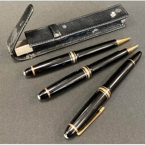 258 - A Montblanc Miesterstuck three piece fountain pen, ballpopint and pencil set, black and gold colours... 