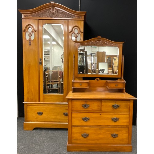 219 - An Edwardian art nouveau walnut wardrobe and matching dressing chest, the wardrobe measuring 211.5cm... 