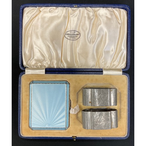 281 - An Art Deco powder blue enamelled sunburst cigarette case, Birmingham 1936, cased;  a pair of Tudric... 