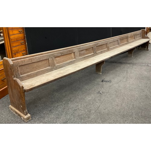 245 - A Church pew, 506cm long.