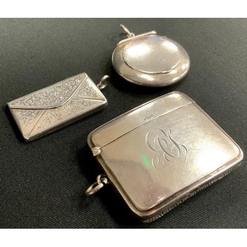 288 - An Edwardian silver envelope stamp case, Chester 1910;  Vesta case, Walker & Hall, Birmingham 1942, ... 