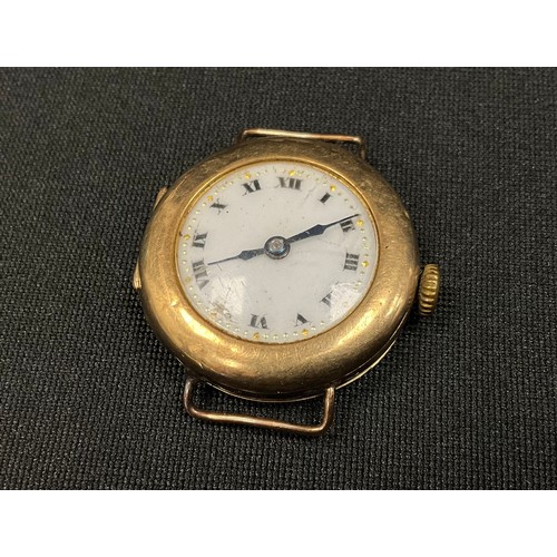 301 - A 1920s 9ct gold cased watch head, white dial, manual wind movement, case London 1925, 12.7g gross.