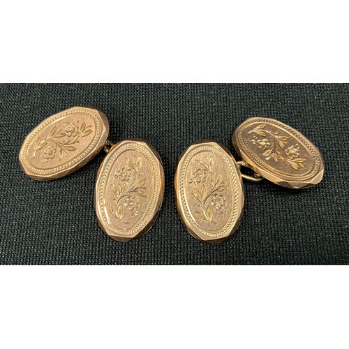 307 - A pair of oval floral panel engraved 9ct gold cufflinks, 6.9g, cased