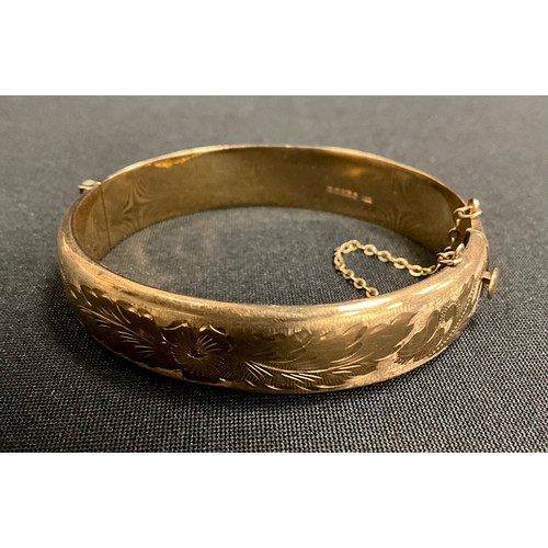 308 - A 9ct gold hollow hinge bangle, Birmingham 1972, 16.6g gross