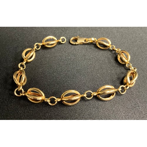 311 - A 9ct gold fancy link bracelet, nine ovoid links, lobster claw clasp, 8.8g gross