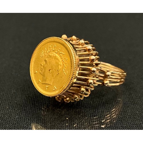 323 - An Iranian gold coin mounted as a ring, unmarked yellow metal multi wire shank, size N, 6.6g gross