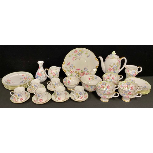 41 - A Royal Doulton tea and coffee set, with coffee pot, pattern number H4135, transfer printed with col... 