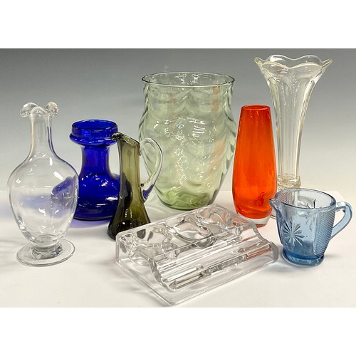 49 - A Whitefriars type green glass ribbed ovoid vase; a clear glass inkwell; an orange glass vase; etc