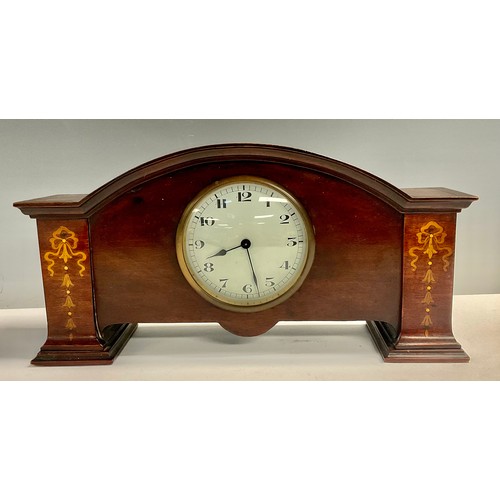 74 - An Art Nouveau mahogany mantel clock, 15cm high, 31cm wide