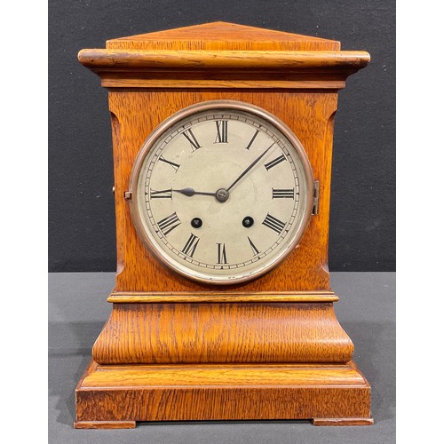 75 - A late 19th century oak mantel clock, Lenzkirch movement, Roman numerals on silvered dial, twin wind... 