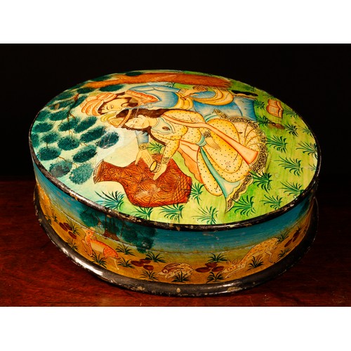 218 - A North Indian/Persian lacquered papier mache oval box and cover, decorated in polychrome with a cou... 