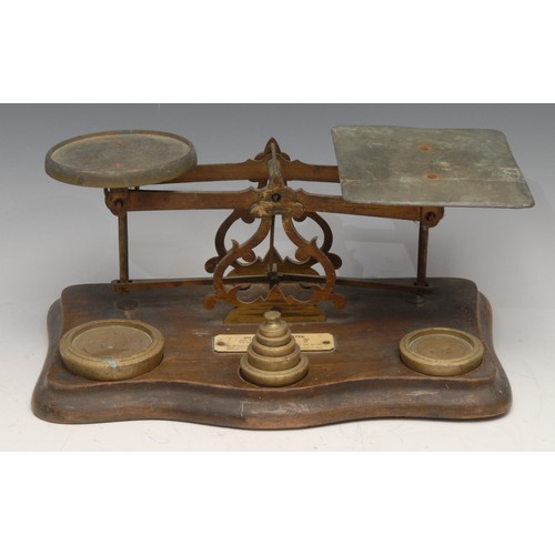 A set of Victorian letter balance postal scales, serpentine base, brass ...