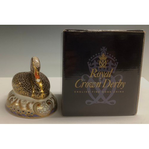 21 - A Royal Crown Derby paperweight, Black Swan, specially commissioned by Royal Doulton to celebrate th... 