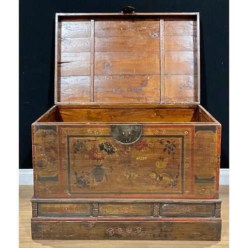 445 - A South-East Asian painted softwood dowry chest, hinged top, the front painted with flowers and temp... 