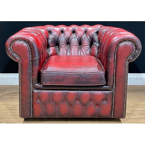 490 - A contemporary Chesterfield type armchair, 66cm high, 93.5cm wide, the seat 45cm wide and 50cm deep