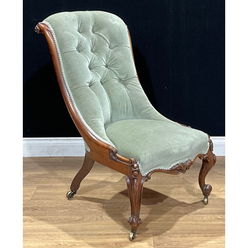 522 - A Victorian rosewood drawing room chair, stuffed-over upholstery, deep-button back, cabriole foreleg... 