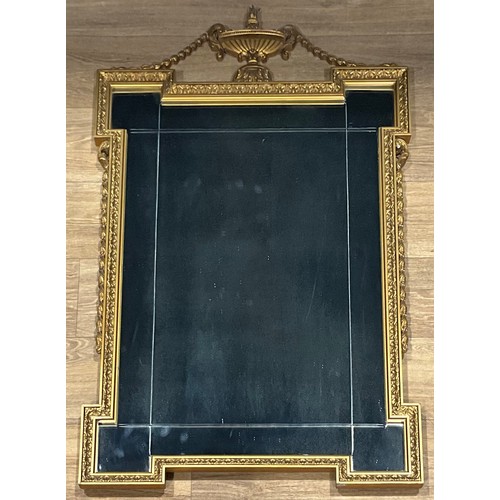 525 - An Adam style gilt coloured looking glass, by Atsonea, shaped rectangular mirror plate, the frame cr... 