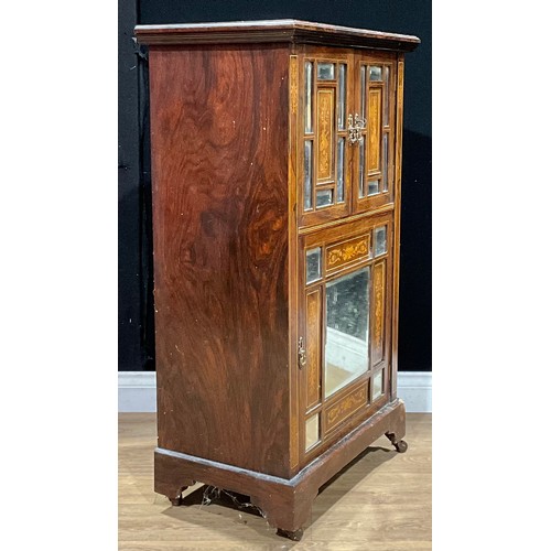 534 - A late Victorian/Edwardian rosewood and marquetry music room cabinet, rectangular top above three do... 