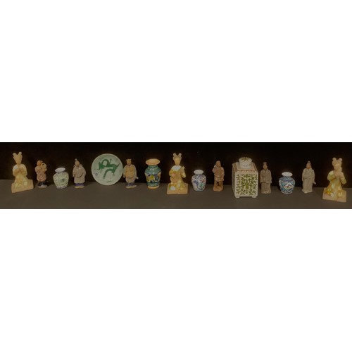 511 - A set of three Chinese terracotta musician figures, drip glazed in green and ochre, 15cm; a set of s... 