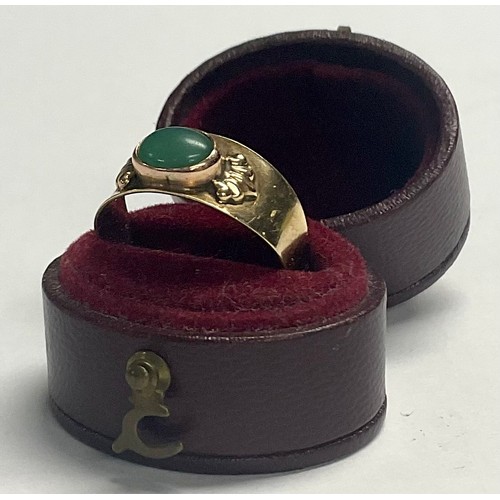 596 - A 14ct gold ring, set with a single polished oval jade cabochon, size N, 2.6g, boxed