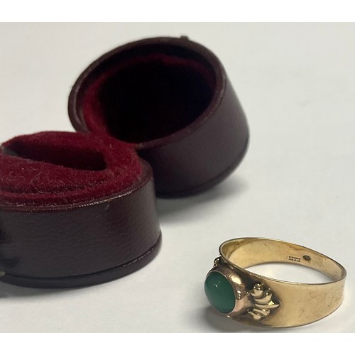 596 - A 14ct gold ring, set with a single polished oval jade cabochon, size N, 2.6g, boxed