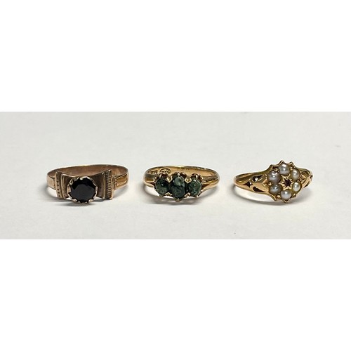 600 - A 19th century 15ct gold flowerhead ring, set with seed pearls and garnet, size N, marked 625, 2.3g;... 