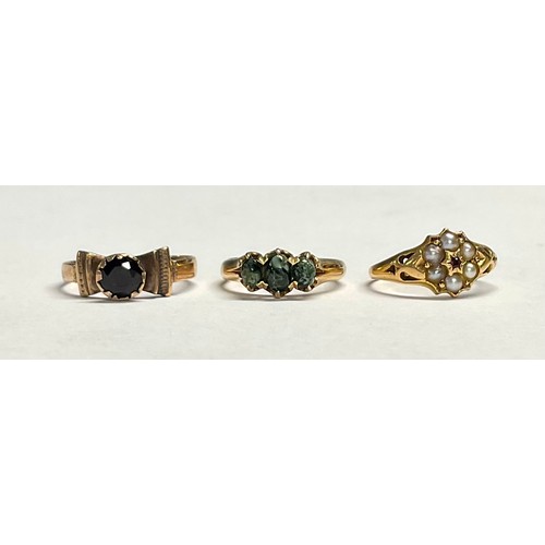 600 - A 19th century 15ct gold flowerhead ring, set with seed pearls and garnet, size N, marked 625, 2.3g;... 