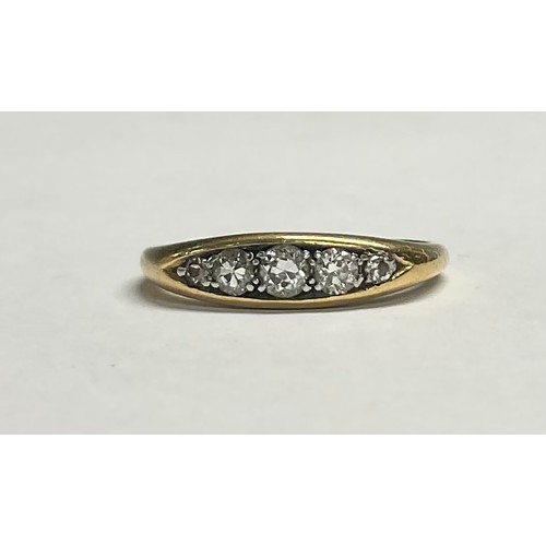 603 - An 18ct gold diamond ring, set with five graduated brilliant cut stones, size O, 4.2g