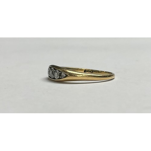 603 - An 18ct gold diamond ring, set with five graduated brilliant cut stones, size O, 4.2g