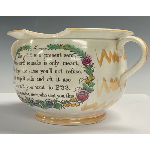 662 - An English lustre pottery marriage chamber pot, printed with verse, the interior with caricature and... 