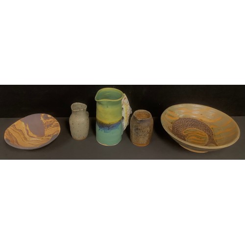 691 - Studio Pottery - a basket of ribbed glazed, plates, bowls, mugs, other studio pottery, jugs; qty