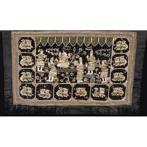 709 - A Burmese Kalaga embroidered silk tapestry, depicting a royal ceremony within a border of dragons, 1... 