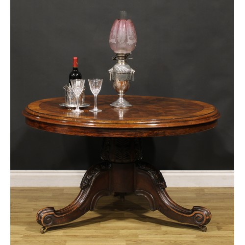 1439 - A Victorian mahogany and rosewood parquetry centre table, circular tilting top with segmented veneer... 