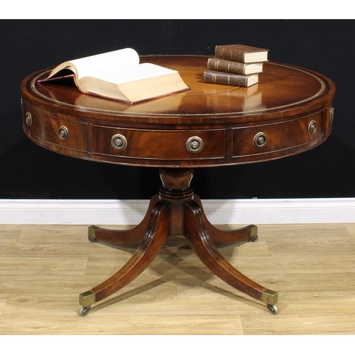 1344 - A Post-Regency mahogany drum table or rent table, circular top with inset tooled and gilt leather wr... 