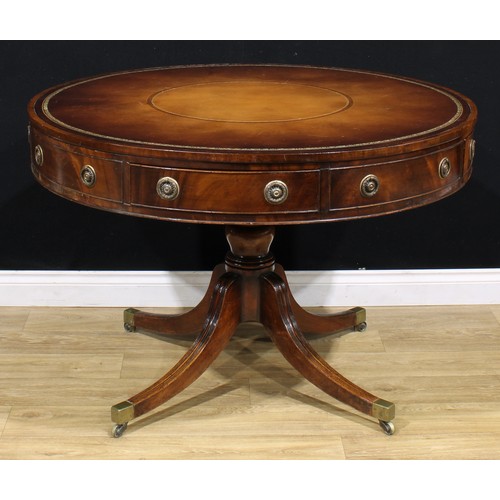 1344 - A Post-Regency mahogany drum table or rent table, circular top with inset tooled and gilt leather wr... 