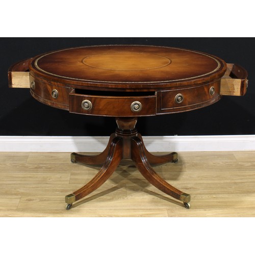 1344 - A Post-Regency mahogany drum table or rent table, circular top with inset tooled and gilt leather wr... 