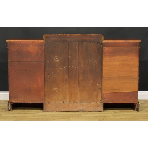 1343 - A Post-Regency mahogany break-centre low library bookcase, by J. Russell, upholsterer, cabinet maker... 