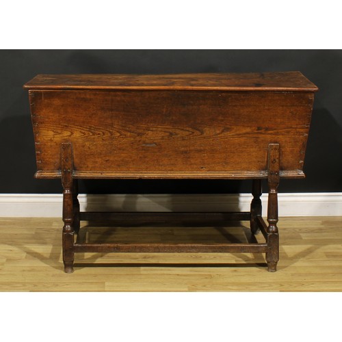 1362 - An 18th century elm dough bin, the base with turned legs, 76cm high, 121cm wide, 45cm deep