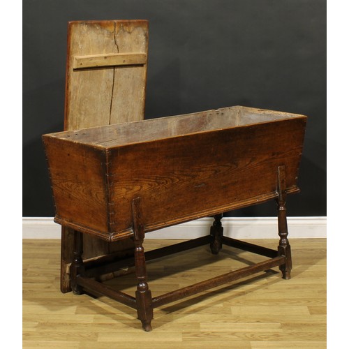 1362 - An 18th century elm dough bin, the base with turned legs, 76cm high, 121cm wide, 45cm deep