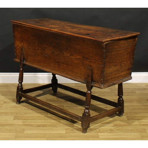 1362 - An 18th century elm dough bin, the base with turned legs, 76cm high, 121cm wide, 45cm deep