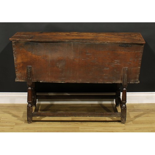 1362 - An 18th century elm dough bin, the base with turned legs, 76cm high, 121cm wide, 45cm deep