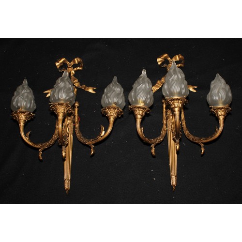 1246 - A pair of Louis XVI style gilt metal three-branch wall lights, cast with quivers and ribbon crest, f... 