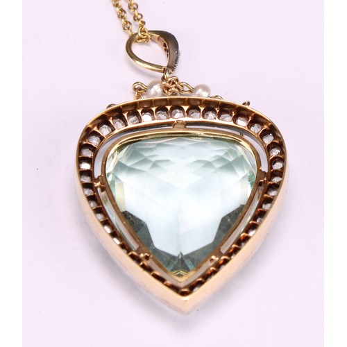 951 - A trilliant cut aquamarine, diamond and gold coloured metal pendant, the central facet cut stone mea... 