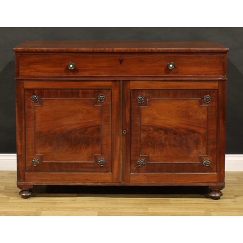 1411 - A George IV mahogany bachelor’s chamber dressing cabinet, slightly oversailing rectangular top above... 