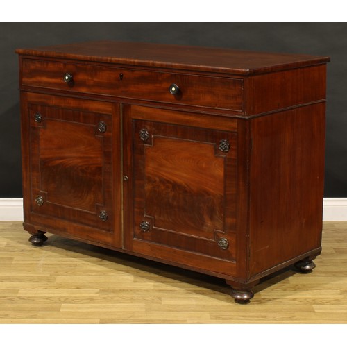 1411 - A George IV mahogany bachelor’s chamber dressing cabinet, slightly oversailing rectangular top above... 