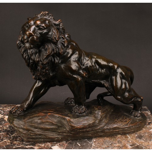 1568 - A Fagalto, after, a bronzed terracotta model, of a lion, standing proud on a rocky outcrop, 46.5cm l... 