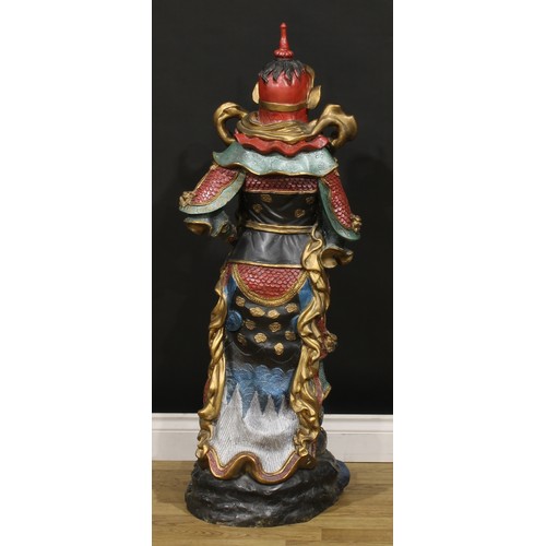 275 - A large painted bronze, of a Japanese warrior, he stands in battle dress with a dragon at his feet, ... 