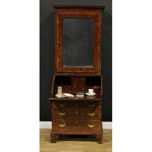 1361 - An 18th century burr yew bureau book cabinet, moulded cornice above a mirrored door enclosing a shel... 